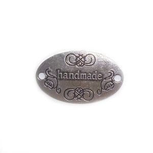 Пришивной элемент HM "Овал" серебро