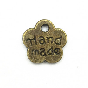 Пришивной элемент HM "Цветок" бронза