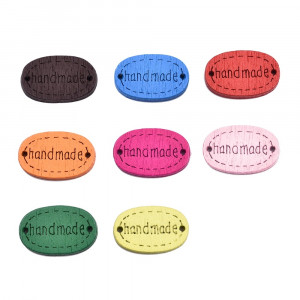 Нашивка деревянная "HM" овал 18*12 мм.